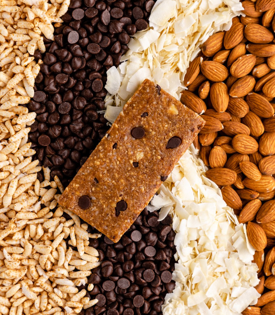 GoMacro coconut chocolate chip MacroBar mini laying on ingredients