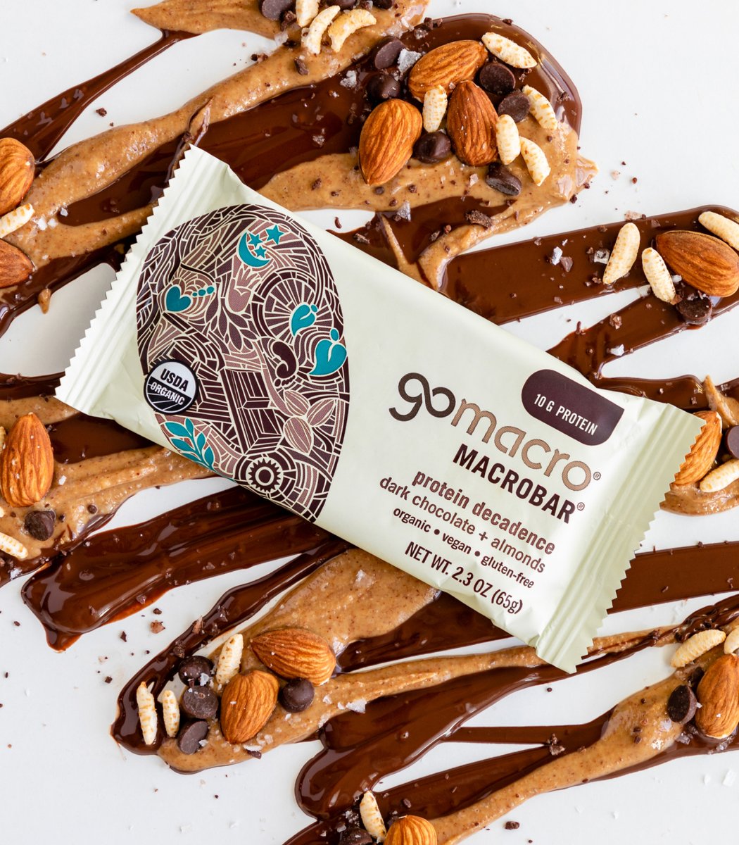 GoMacro protein decadence bar laying on drizzle of chocolate