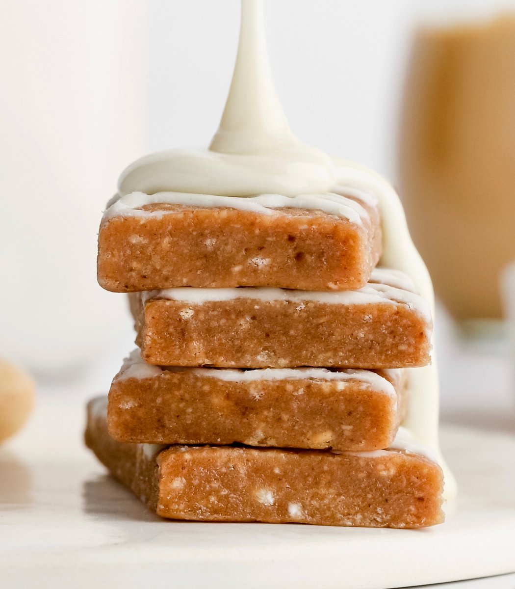 Stack of GoMacro Cinnamon Roll Kids Bars drizzled in frosting