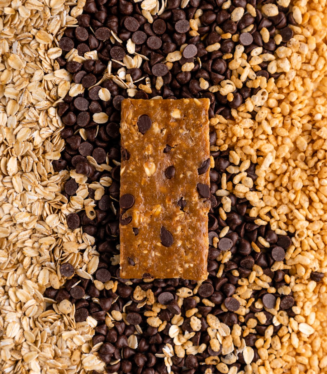 GoMacro Oatmeal Chocolate Chip MacroBar Mini laying on chocolate chips
