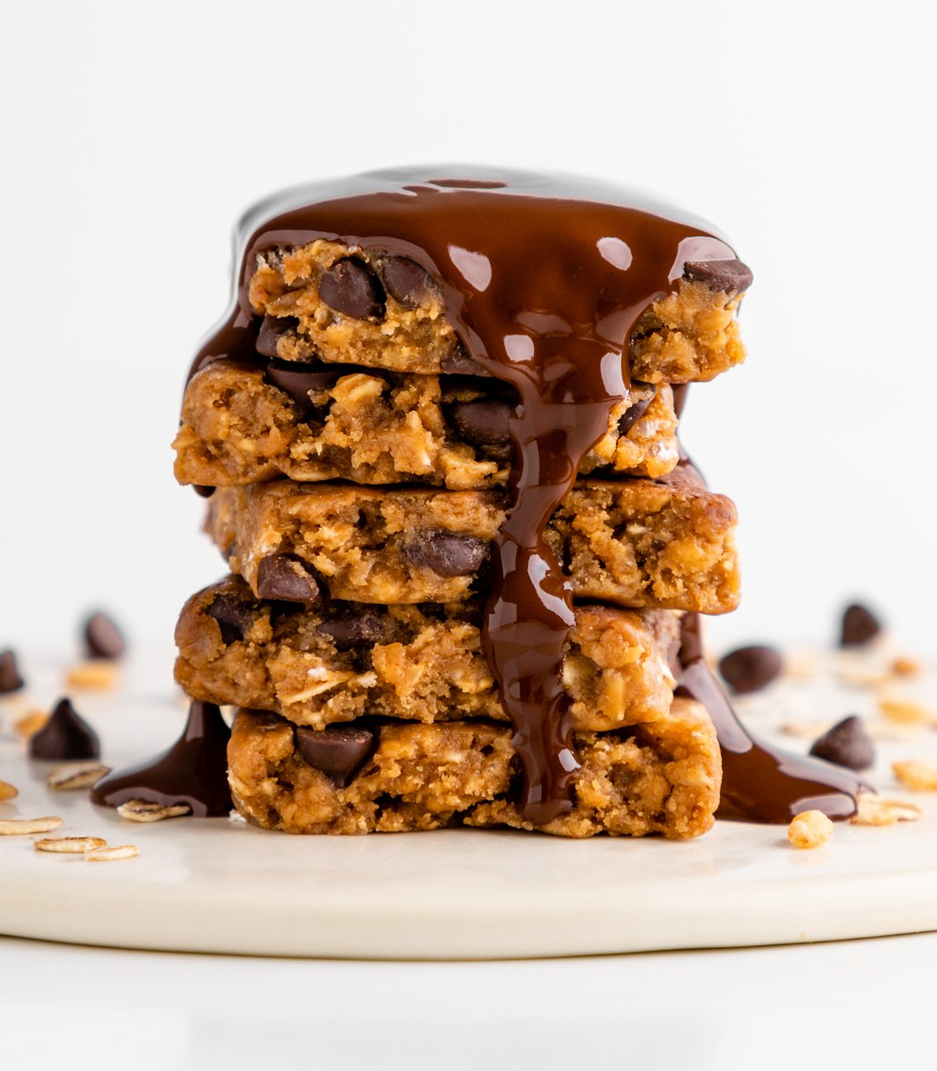 Stack of GoMacro Oatmeal Chocolate Chip MacroBar Minis drizzled in chocolate