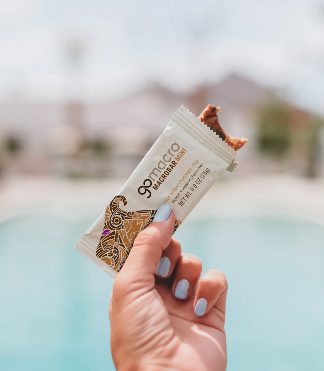 Person holding GoMacro peanut butter chocolate chip mini