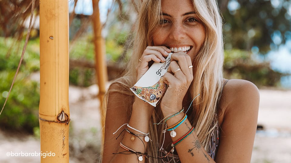 Woman eating a GoMacro MacroBar