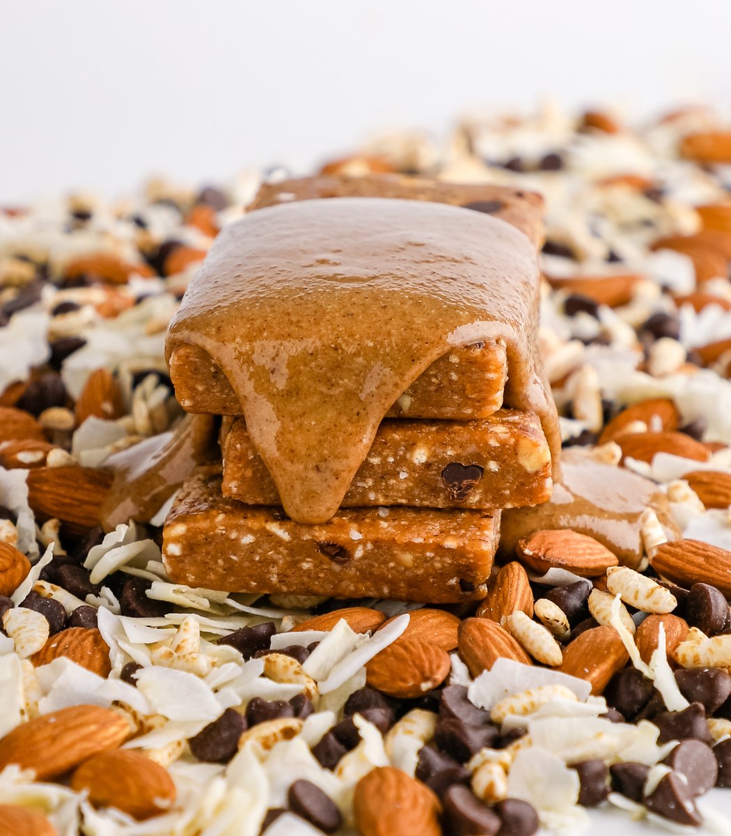 Stack of GoMacro MacroBar Minis drizzled in almond butter