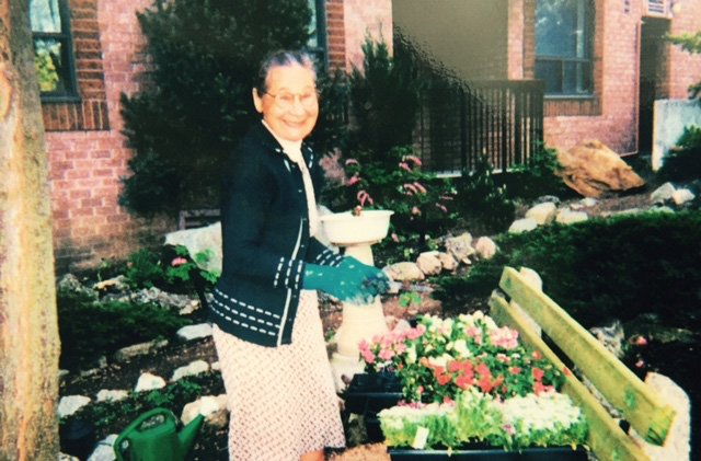 Amelia's mother working in flower garden