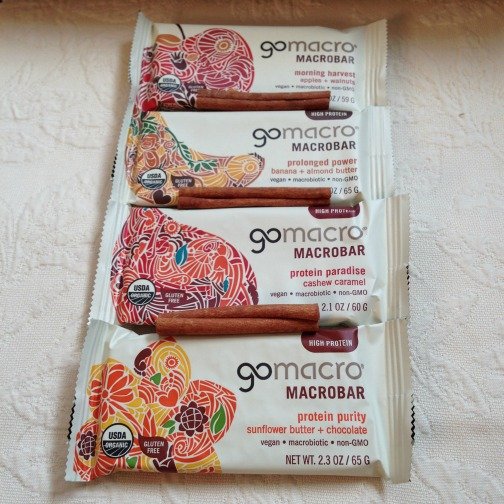 Four GoMacro protein bars with cinnamon