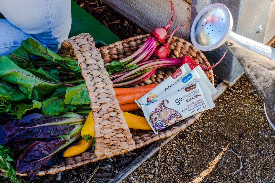 Basket with vegetables and GoMacro protein bars in it