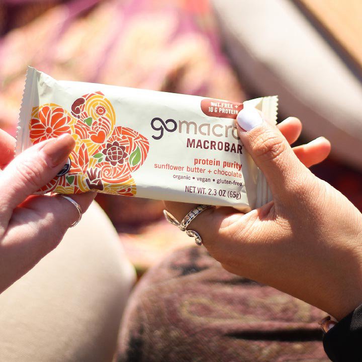 GoMacro MacroBar protein purity being handed to someone
