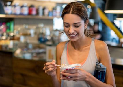 Woman eating yogurt