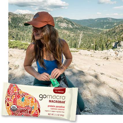 Woman outside and GoMacro Protein Paradise MacroBar