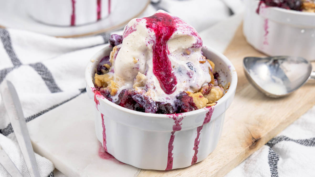 A bowl of berry cobbler with ice cream and GoMacro protein bars