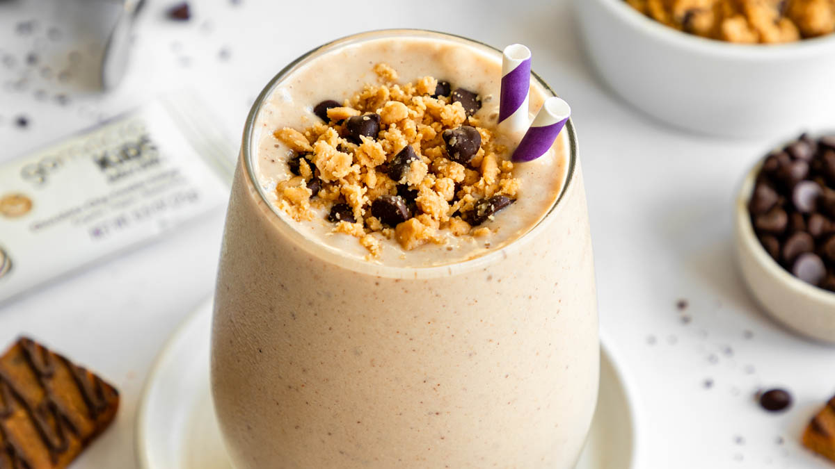 Cookie dough smoothie topped with crumbled kids chocolate chip cookie dough MacroBar