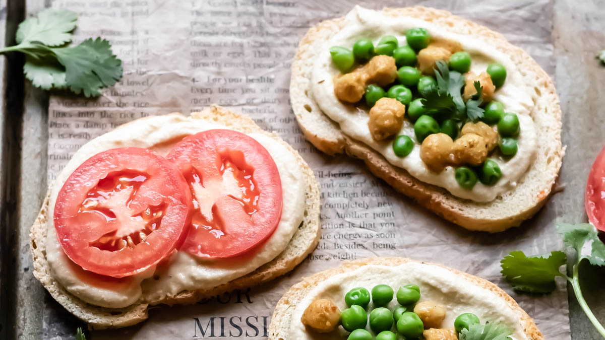 Hummus and tomato on top of bread