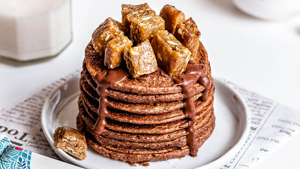 Chocolate pancakes with cut up GoMacro peanut butter bar on top