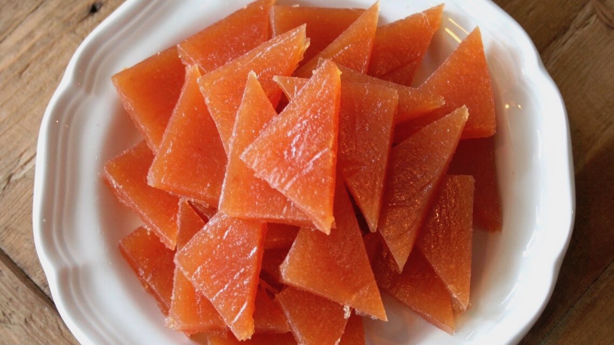 Quince paste cut up on a plate