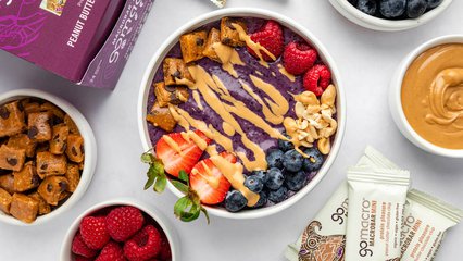 Peanut Butter & Jelly Smoothie Bowl topped with GoMacro peanut butter chocolate chip bar
