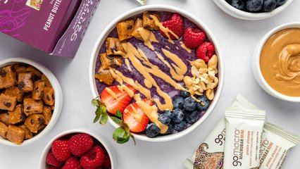 PB&J smoothie bowl topped with GoMacro peanut butter chocolate chip protein bar