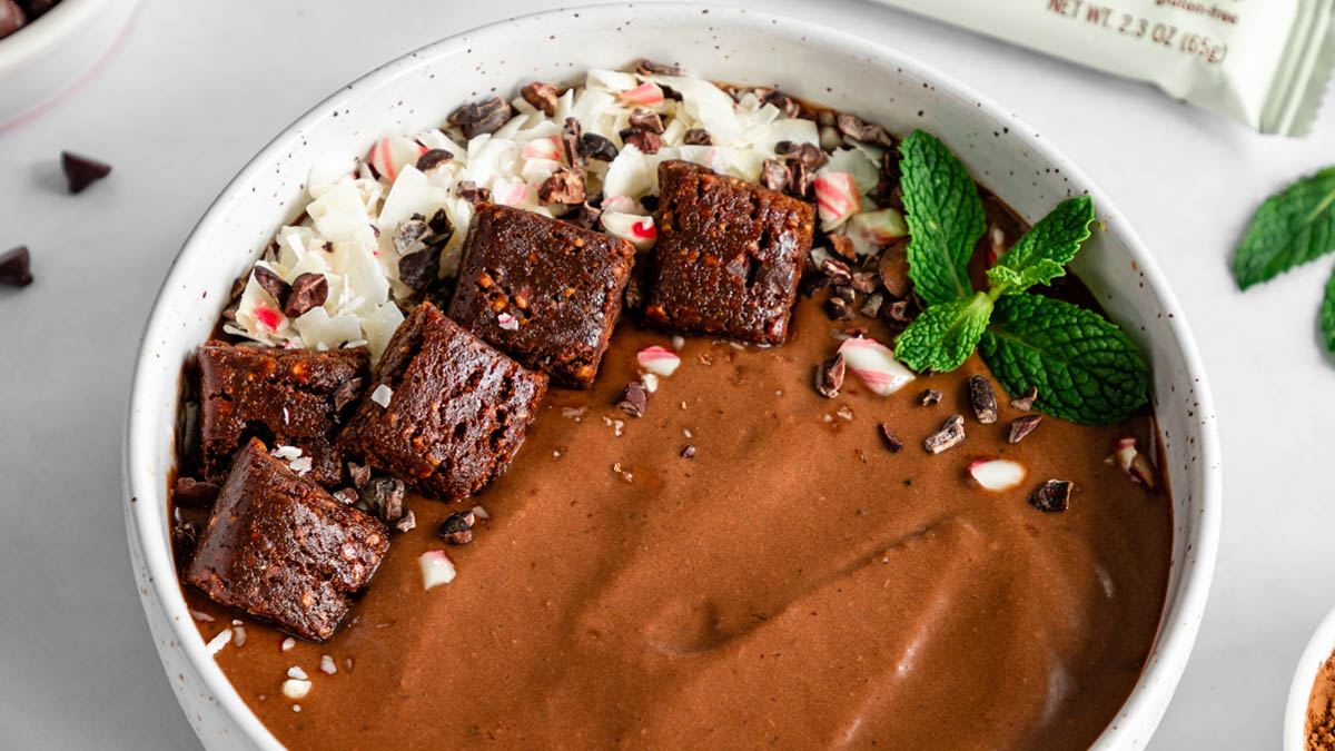 Chocolate smoothie bowl topped with peppermint and GoMacro mocha bar