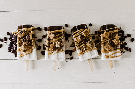 Coffee and coconut milk popsicles with bits of GoMacro bar everlasting joy on top