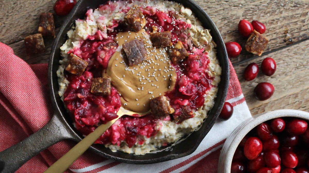 Cranberry apple oatmeal topped with crumbled GoMacro cherries + berries bar on top