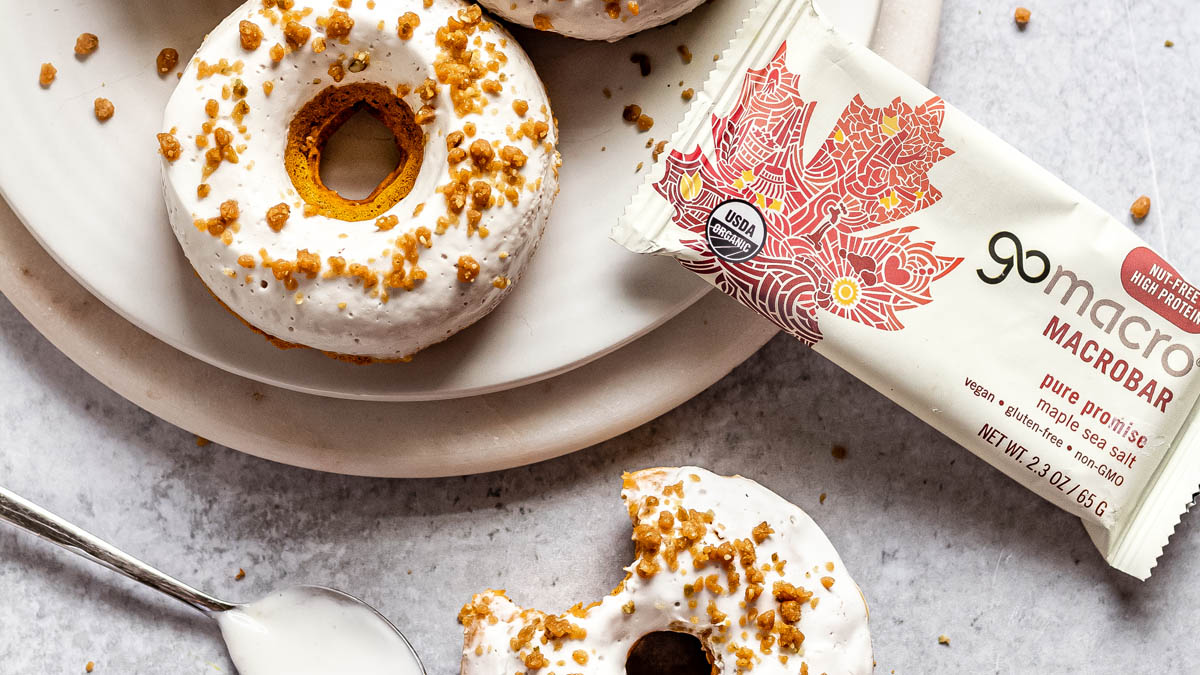 GoMacro protein bar next to baked pumpkin donuts with maple glaze