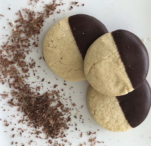 Gluten-free shortbread cookies half dipped in chocolate