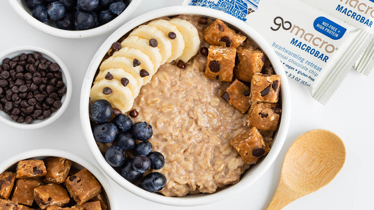 Oatmeal bowl topped with GoMacro oatmeal chocolate chip bar