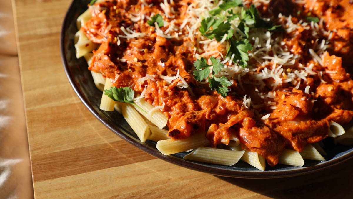 A bowl of vegan penne pasta