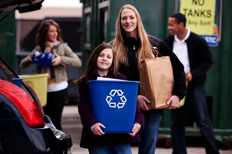 Two girls recycling