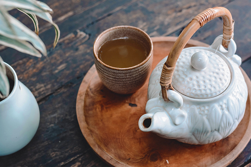 Teapot next to teacup