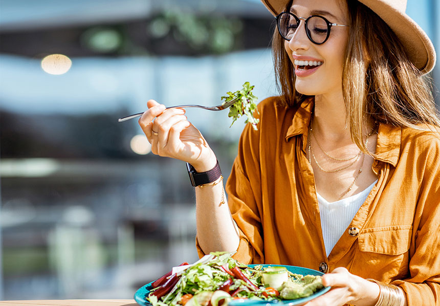 Woman eating a vegan salad