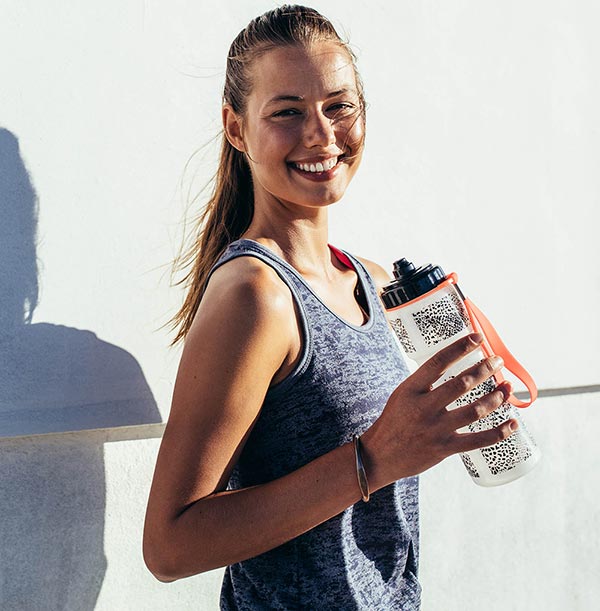 Woman holding water bottle